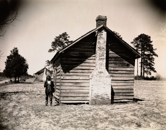 Walker Evans: [Man Posing for Picture in Front of Wooden House], 1936&copy; Walker Evans Archive, The Metropolitan Museum of Art