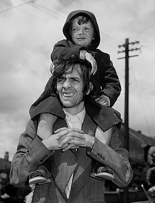 Chris KillipWatching the Parade, West-End, Newcastle, 1980© Chris Killip