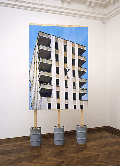Stefan BurgerLeap into the void under the supervision of a committee of experts, 2006Inkjet-print on wooden wall, concrete, metal drums, 400 x 200 x 80 cm&copy; Stefan Burger