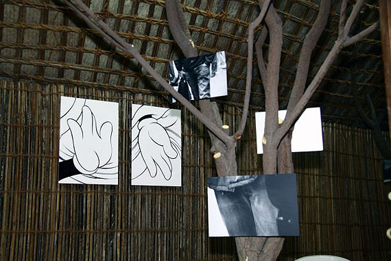 Rosalind NashashibiShelter for a New Youth, 2011, mixed-media installation, photographs mounted on aluminum and acrylic paint on MDF, painting on wood, trees, areeshCourtesy of the artist and Tulips & Roses, Brussels. Commissioned by Sharjah Art Foundation with support from the British CouncilInstallation view, photo by Alfredo Rubio