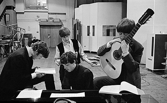 David Hurn - G.B. England. London. The Beatles in the Abbey Road Studios, where many of their most famous records were made, examining the script of the film 'A Hard Days Night'.© David Hurn/Magnum Photos