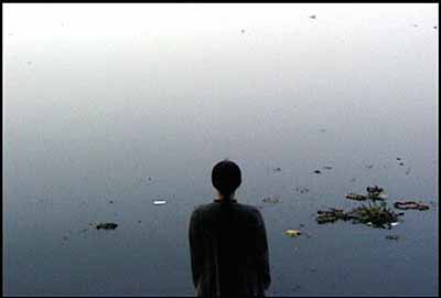 A Laundry Woman, 2000, video still from performance, Yamuna river, Delhi