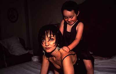 Julia sitting on Maria's back, Paris, 2001