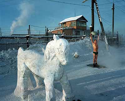 Carl De KeyzerPrisoner demonstrates resistance to temperatures of -50C by taking a shower © Magnum Photos