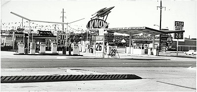 Knox Less, Oklahoma City, Oklahoma, from the series TwentySix Gasoline Stations, 1962 Gelatin silver print 4 15/16 x 10 9/16 in. Whitney Museum of American Art, New York; Purchase, with funds from The Leonard and Evelyn Lauder Foundation, and Diane and Thomas Tuft 2004.479 © Edward Ruscha