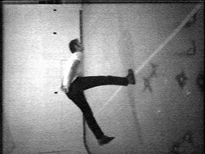 Bruce Nauman, Slow Angle Walk (Beckett Walk), 1968, videotape, black and white, sound 60 min., to be repeated continuously. Distributed by Electronic Arts Intermix (EAI) Courtesy Sperone Westwater, New York.