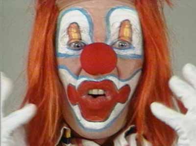 Bruce Nauman, Clown Torture, 1987, 4 colour video monitors, 4 speakers, 4 videotape players, 2 video projectors, 4 videotapes, dimensions variable. Courtesy of Sperone Westwater Gallery , New York.