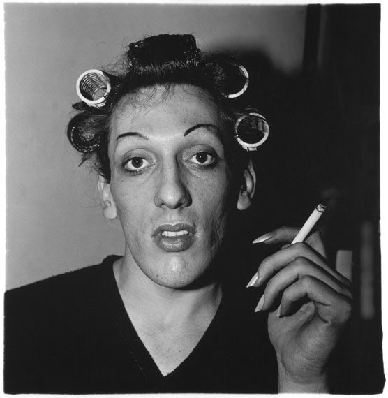 Diane ArbusA young man in curlers at home on West 20th Street, N.Y.C. 1966© The Estate of Diane Arbus